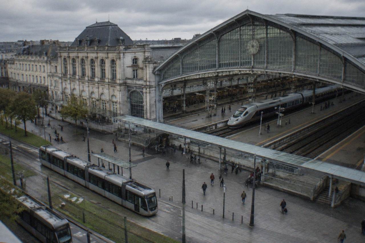 A high-speed TGV train waiting at a platform in a French railway station