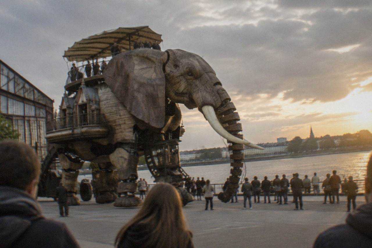 A giant mechanical elephant walking along the Loire waterfront on the Île de Nantes