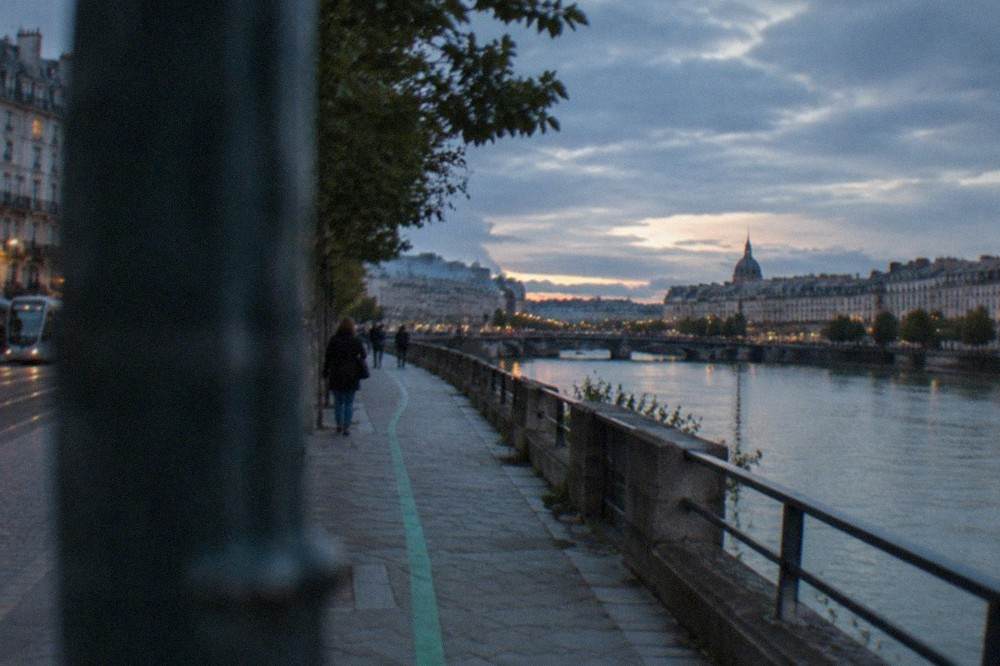 A painted green line running along a Nantes pavement guiding walkers between sites