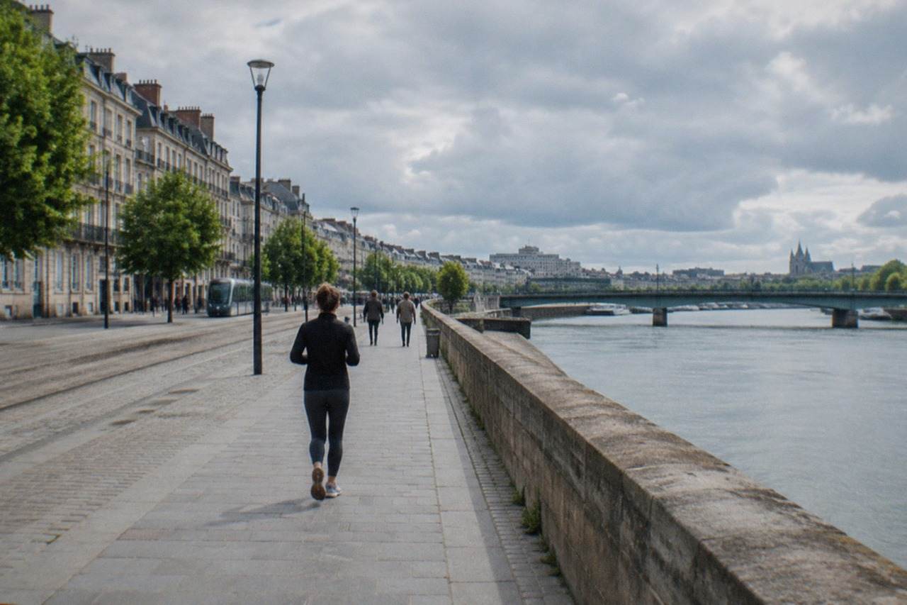 The Loire river flowing past the quays and bridges of Nantes on a bright day