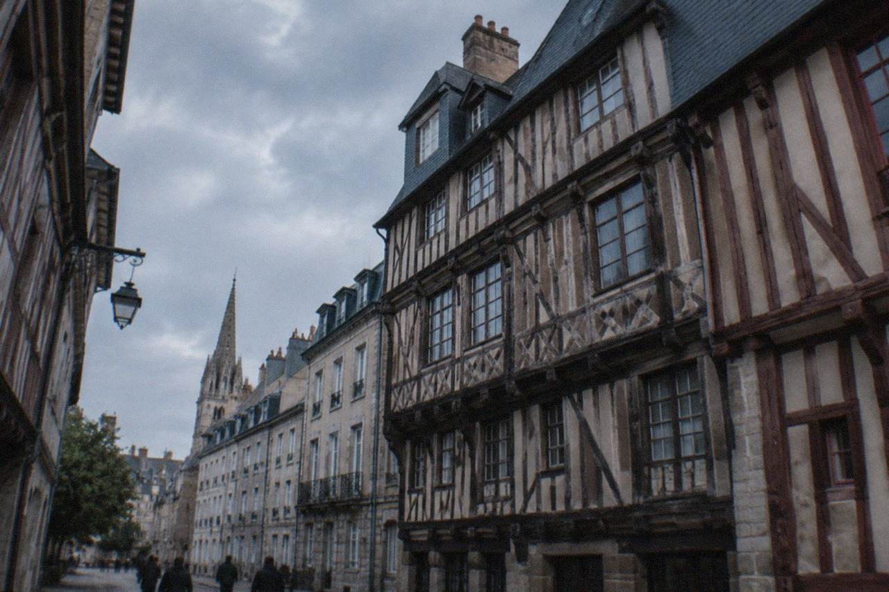 Half-timbered medieval houses on a narrow street in Rennes city centre