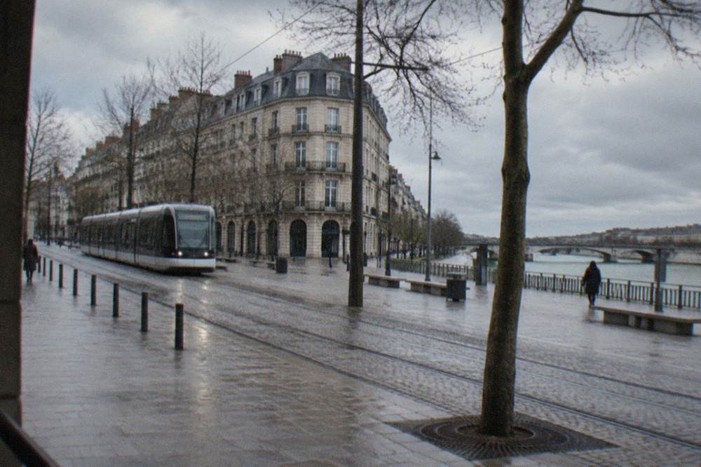 Empty winter street in central Nantes with trams and bare trees