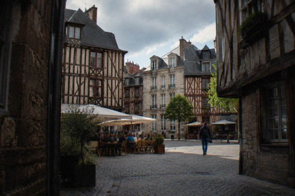 A street sign and shop awning on a pedestrian street in the Bouffay quarter of Nantes