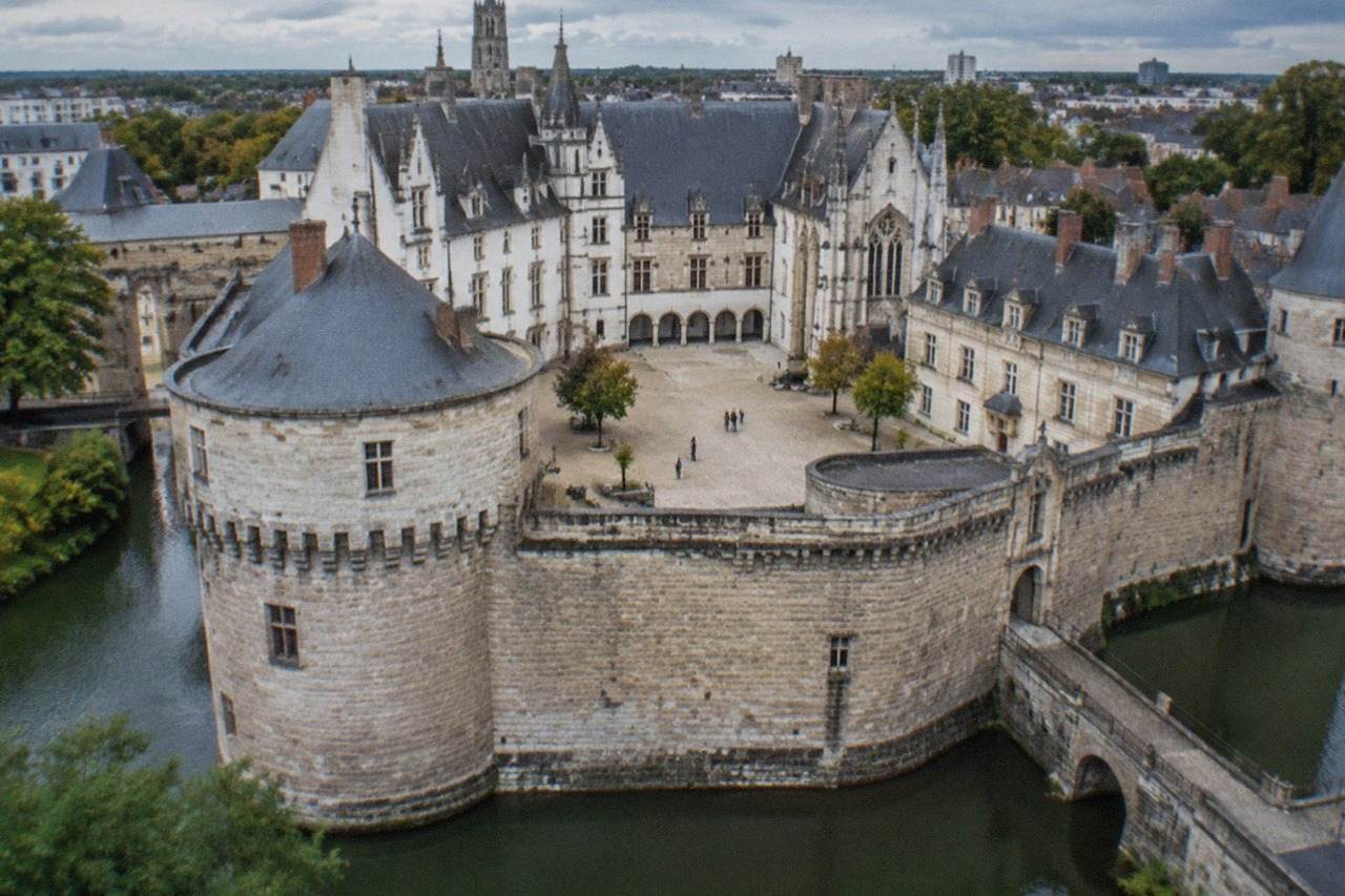 View over the Château des ducs de Bretagne and its ramparts in central Nantes on a bright day