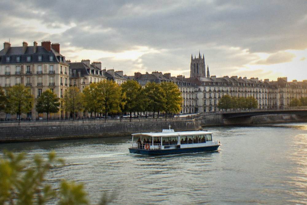A small river shuttle boat crossing the Loire between two districts of Nantes