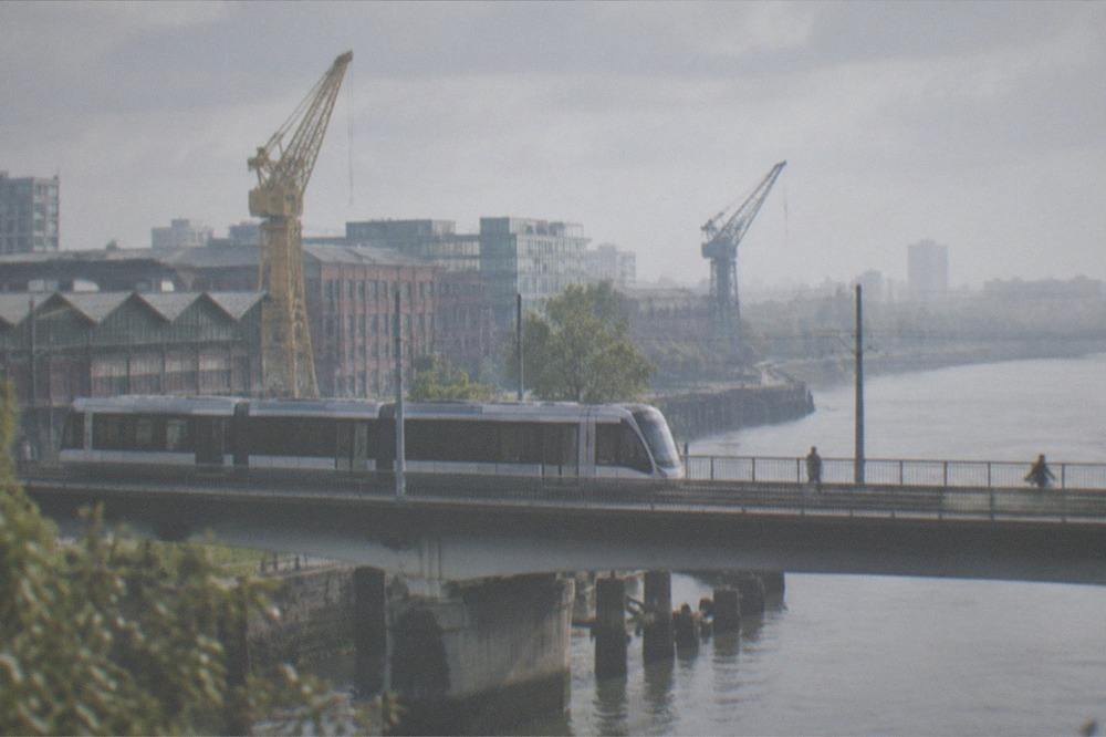 A Nantes tram crossing one of the bridges onto the Île de Nantes with the Loire alongside