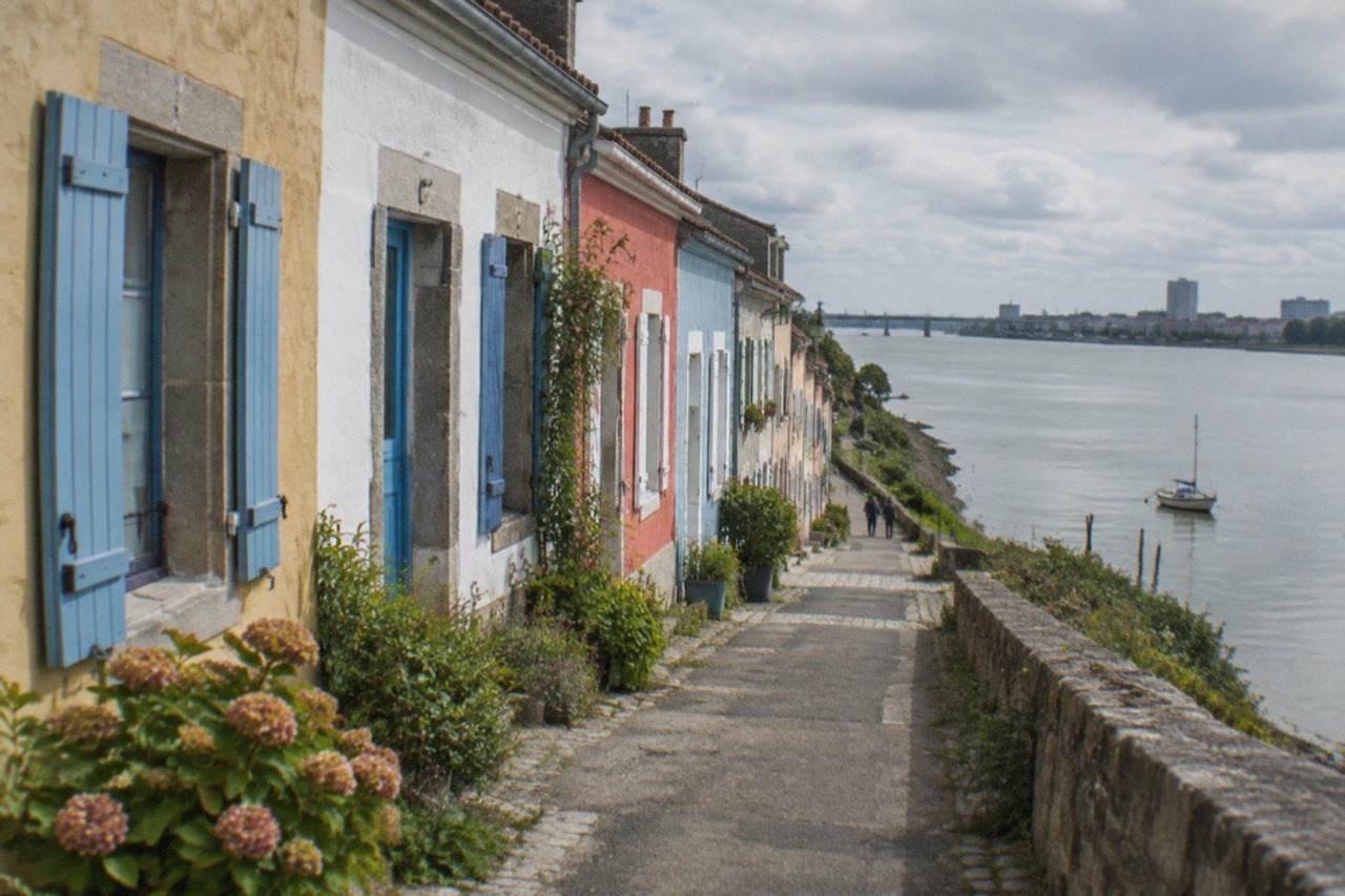 Rows of small colour-washed fishermen's houses along the waterfront at Trentemoult