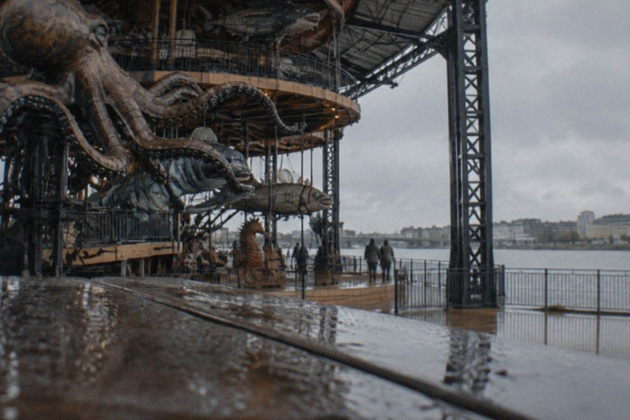 A giant three-level marine carousel with moving sea creatures under a canopy on the Île de Nantes
