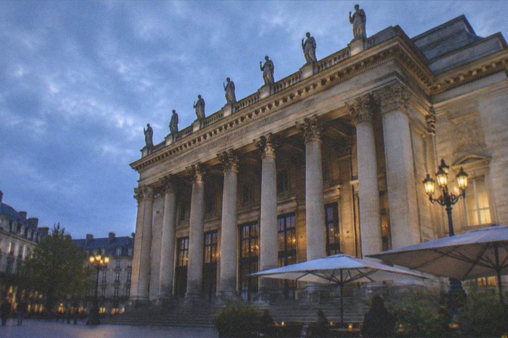 The ornate 19th-century facade and lanterns of the Theatre Graslin near the Musee Dobree in Nantes
