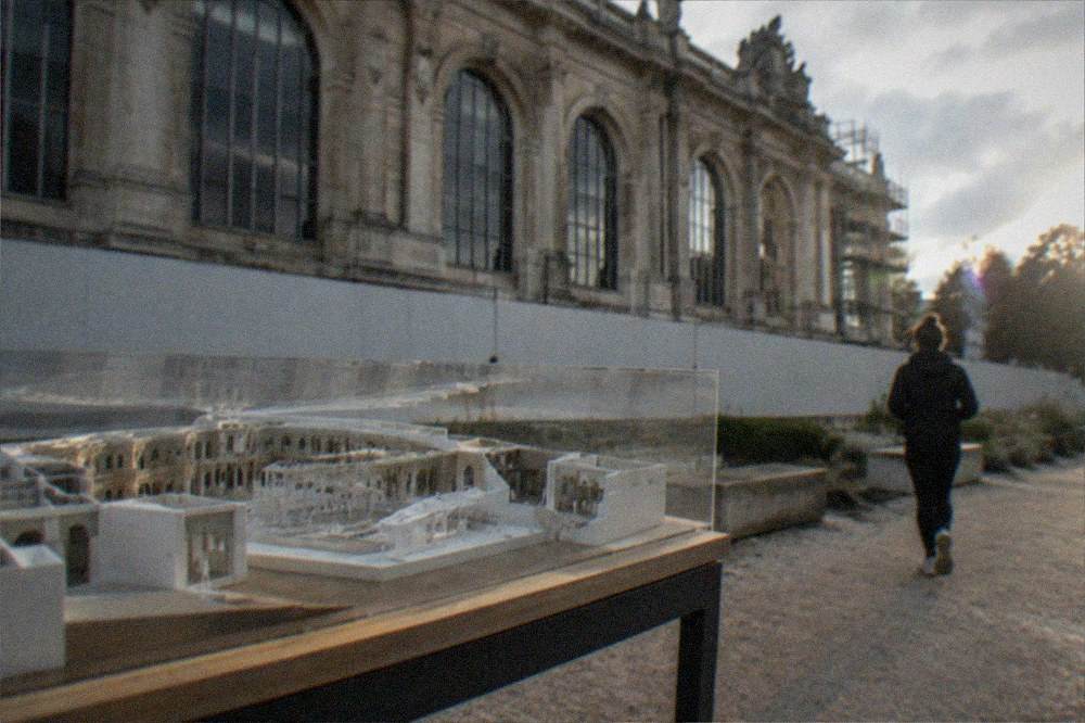 An architectural model of a renovated museum interior on a display table