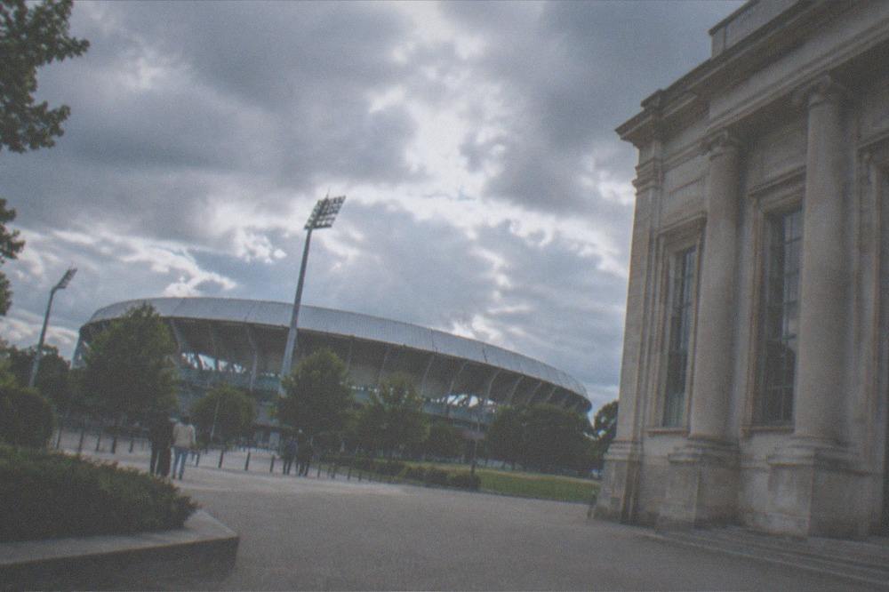 The classical stone facade of a city museum with columns and tall windows