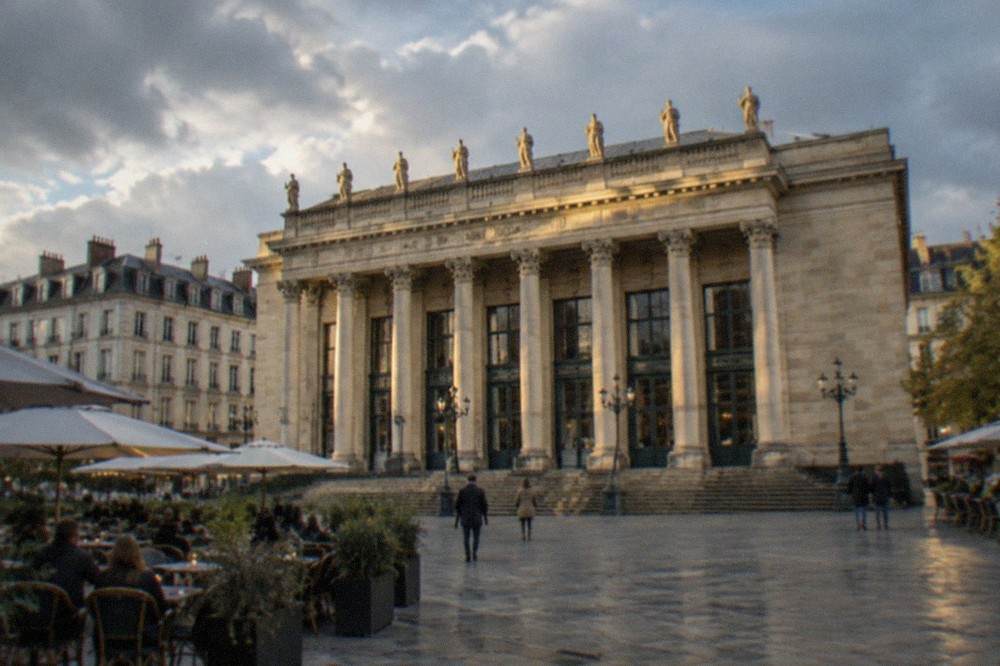 Evening light on the Theatre Graslin facade with cafe terraces along the square