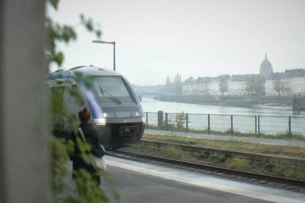 A TER regional train calling at a small station on the line between Nantes and the coast