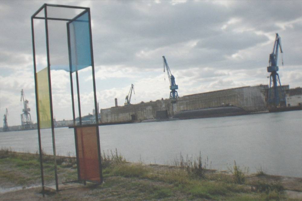 A contemporary art installation standing on the bank of the wide lower Loire near the estuary