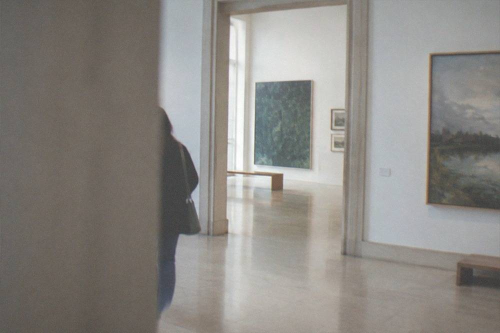 A bright museum gallery interior in Nantes with level stone flooring and wide doorways