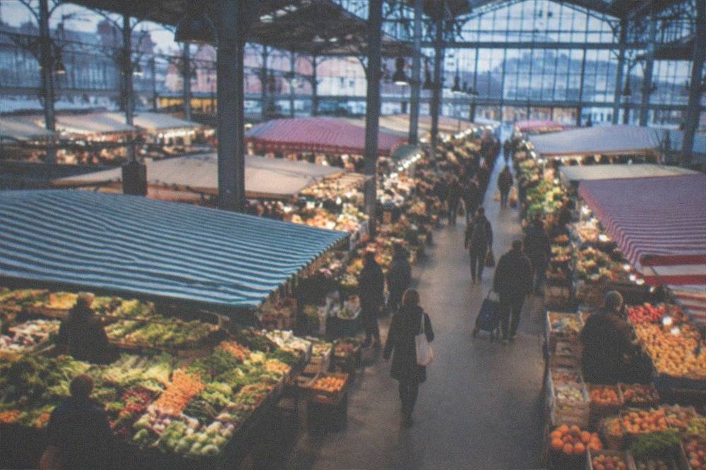 A market stall with fresh produce under the covered hall of the Talensac market in Nantes