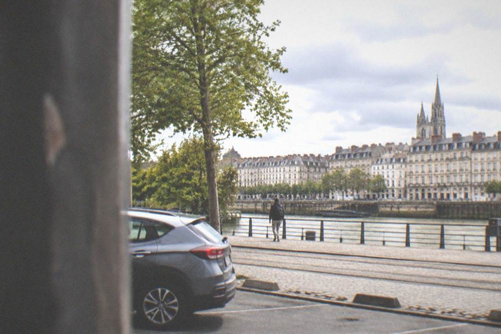 A hire car parked at a tram-side park and ride on the edge of Nantes