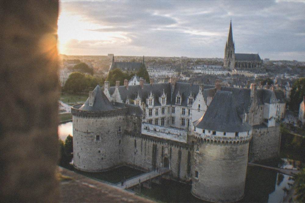 Aerial view of Nantes city centre showing the castle ramparts, cathedral spire and rooftops of western France