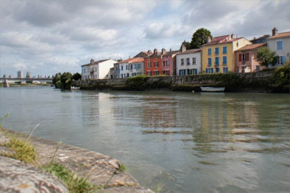 The colourful fishermen's houses of Trentemoult seen across the Loire from Nantes