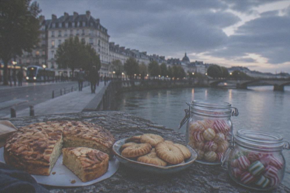 Three Nantes sweet specialities side by side: sliced almond cake, butter biscuits and jars of striped candies