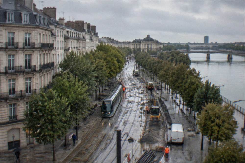 Construction equipment and freshly laid tram rails on a Nantes boulevard