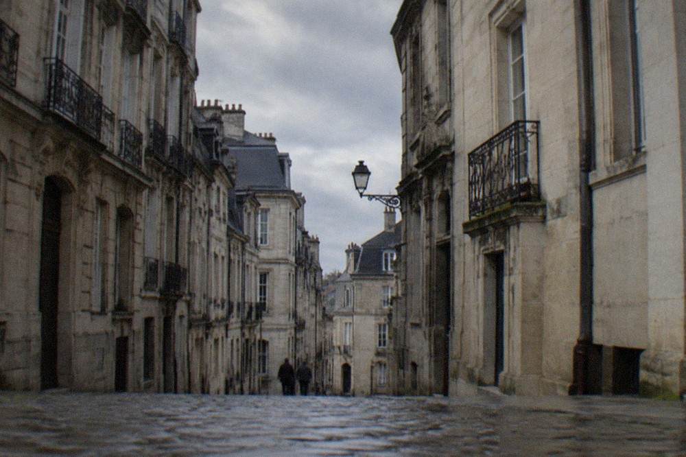 Narrow street of leaning old facades on the Île Feydeau in Nantes