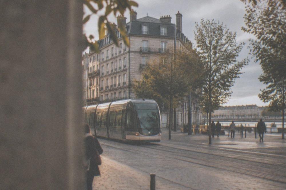 A tram gliding along a pedestrianised street in central Nantes