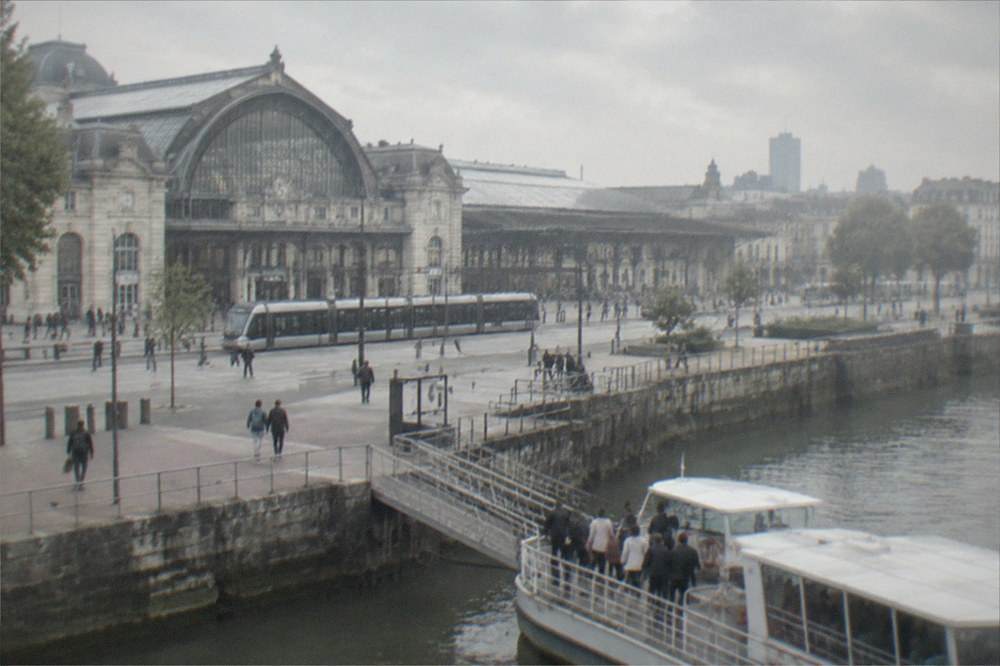 Couples boarding a river shuttle boat on a city quay