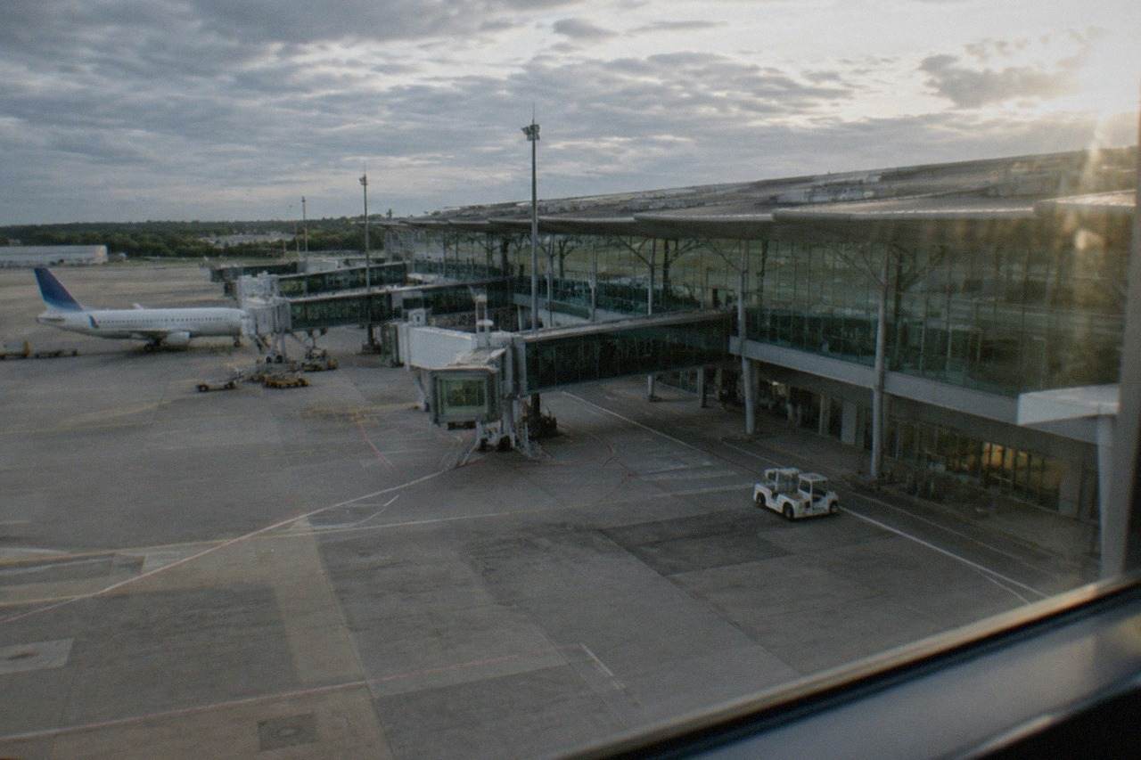 The modern terminal building of Nantes Atlantique Airport under a clear sky
