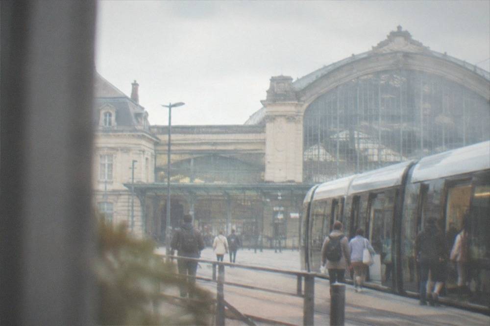 Passengers boarding a tram outside Nantes railway station