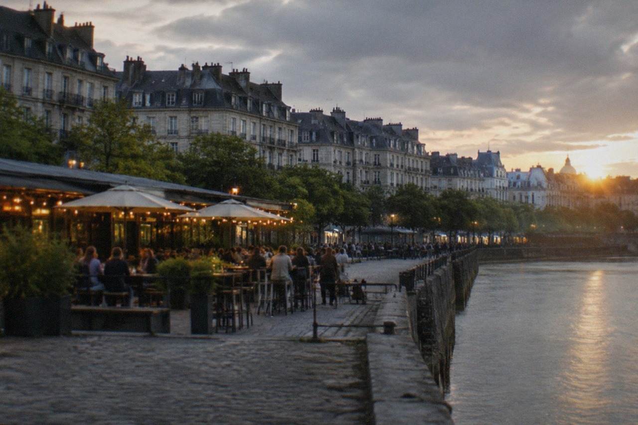 Illuminated riverside bars along the Loire in Nantes at dusk
