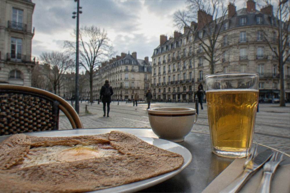Buckwheat crepe and cider on a table in a small Nantes creperie
