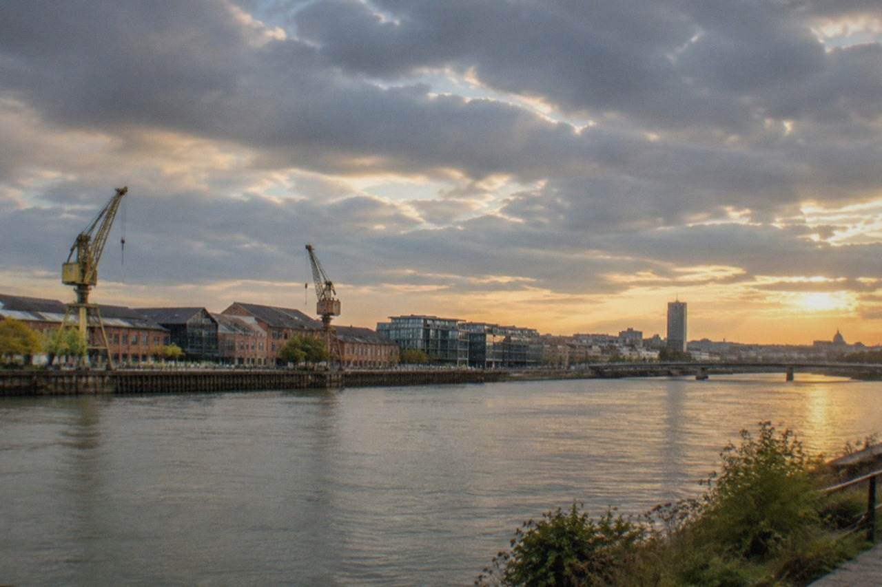 Panoramic view over the Loire river and the Île de Nantes skyline at golden hour