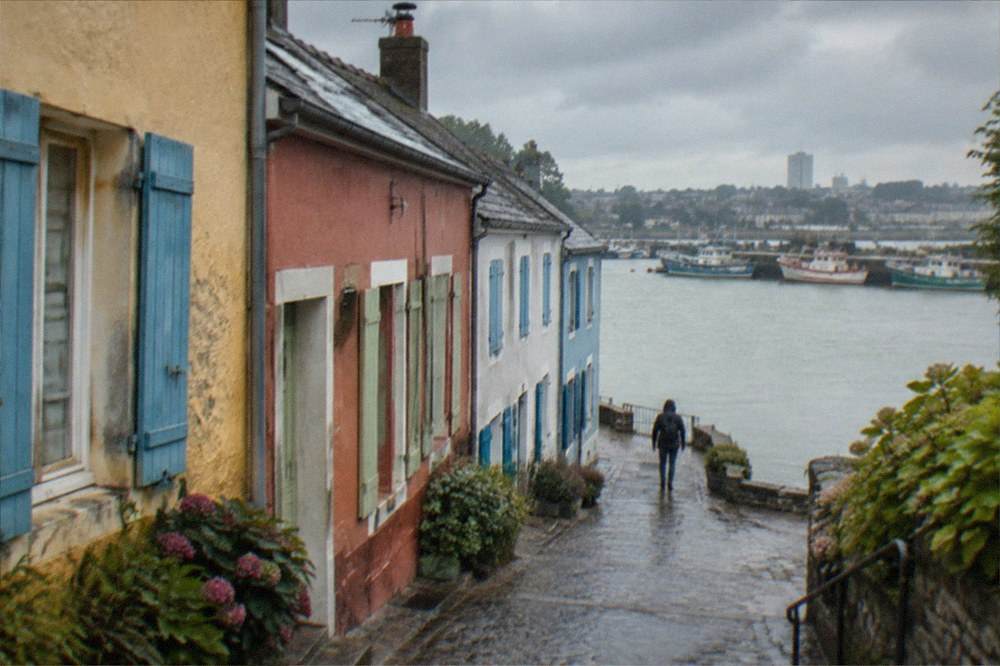 Fishing boats moored in the colourful harbour of Trentemoult across the Loire from Nantes
