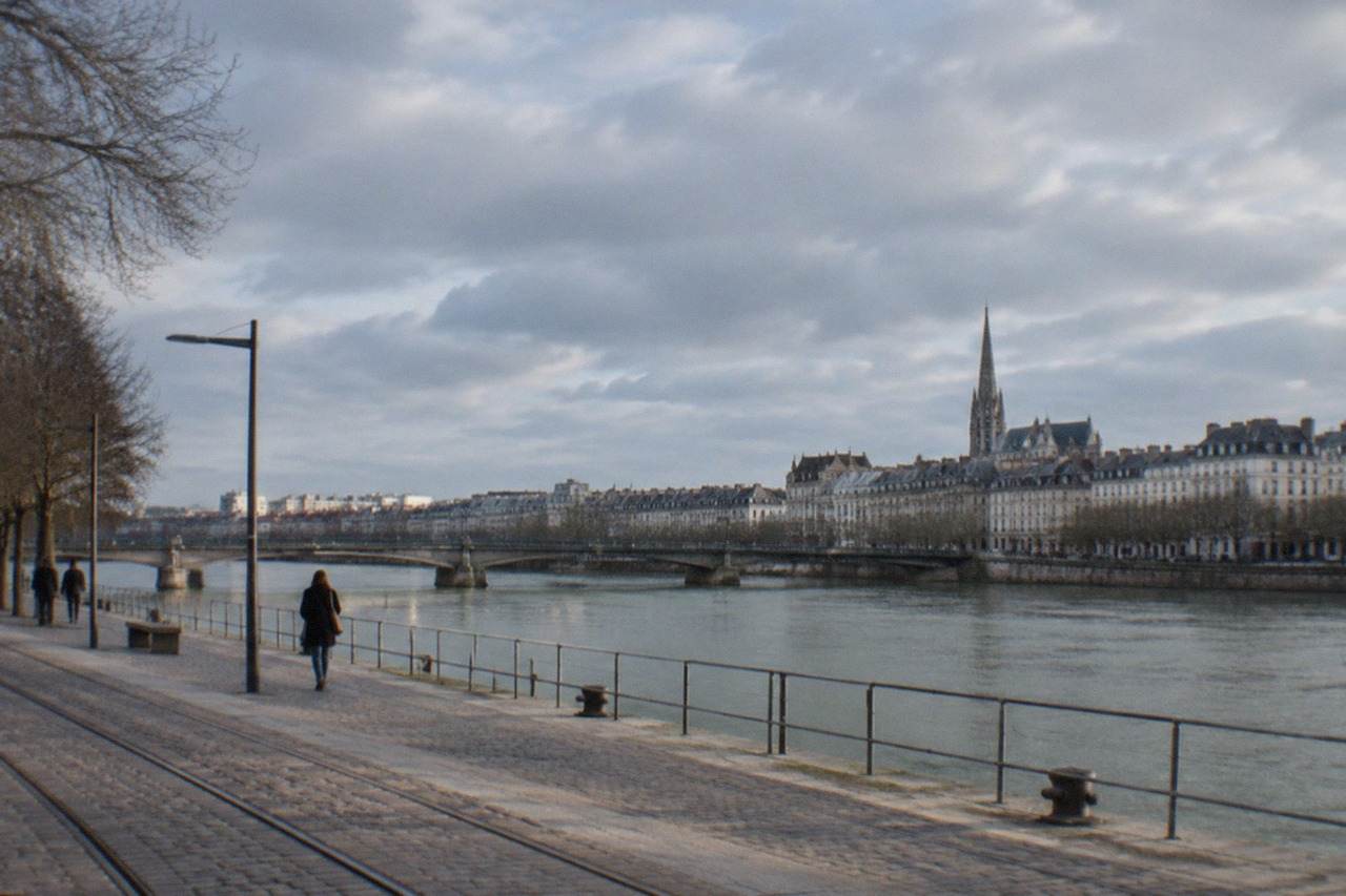 Nantes skyline on a mild day, the cathedral spire rising above the rooftops beside the Loire