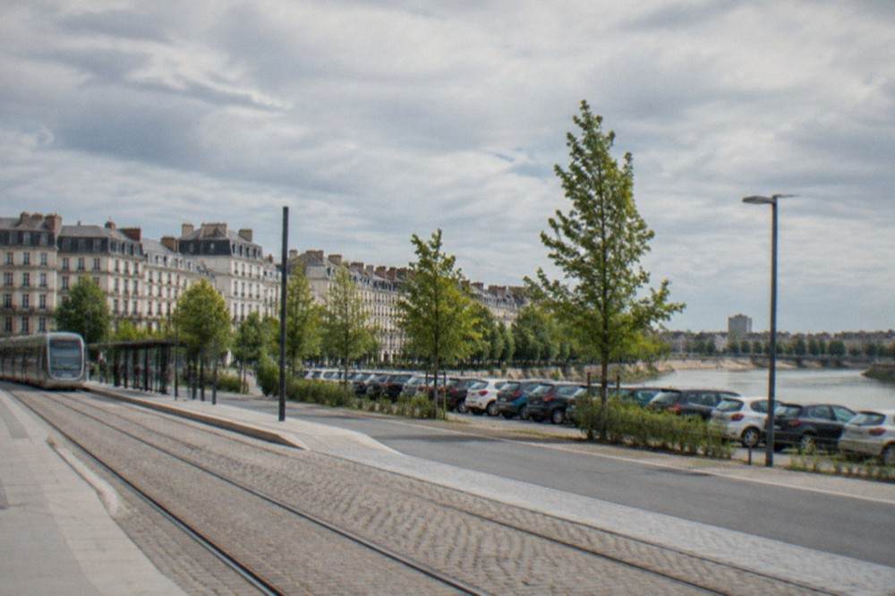 A park-and-ride car park beside a tram stop on the edge of Nantes