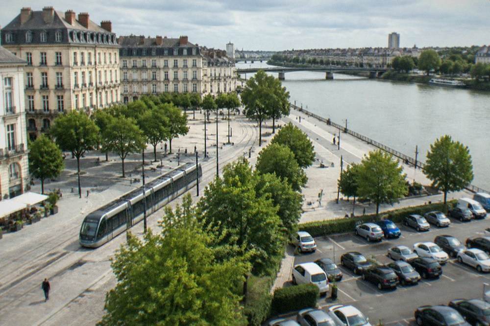 Cars parked in rows at an outdoor park-and-ride car park near Nantes
