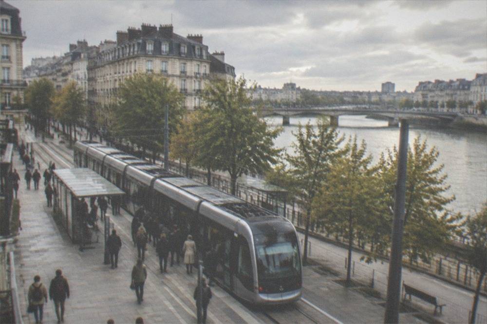 A busy Nantes tram platform on a weekend with passengers boarding