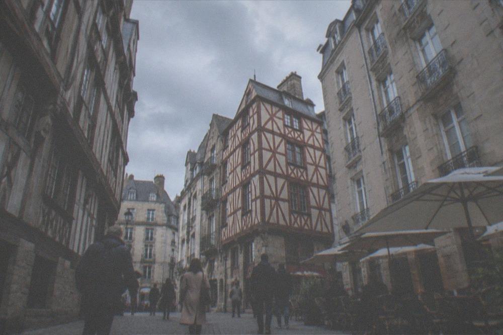 Pedestrians walking through a car-free street in the Bouffay old town of Nantes