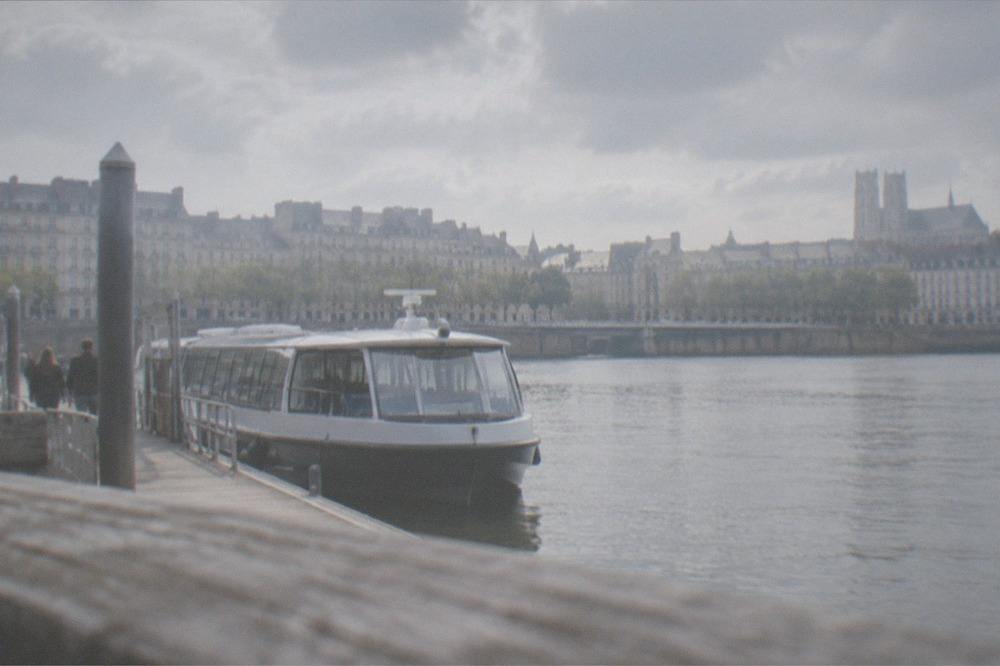 A Navibus river shuttle moored at a wooden pontoon on the Loire in Nantes