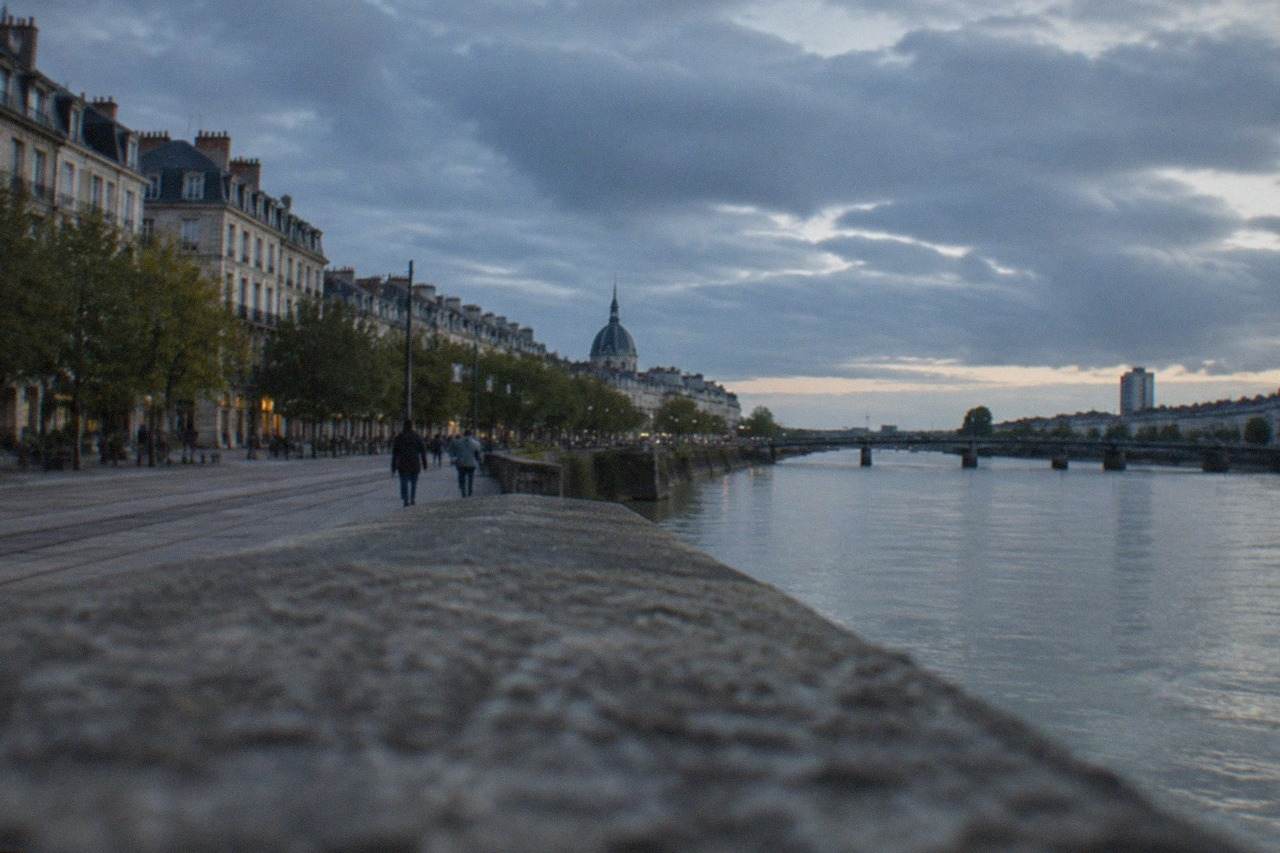 The Loire river flowing past the city of Nantes on a bright afternoon