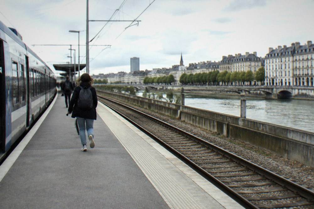A TER regional train waiting at a station platform outside Nantes