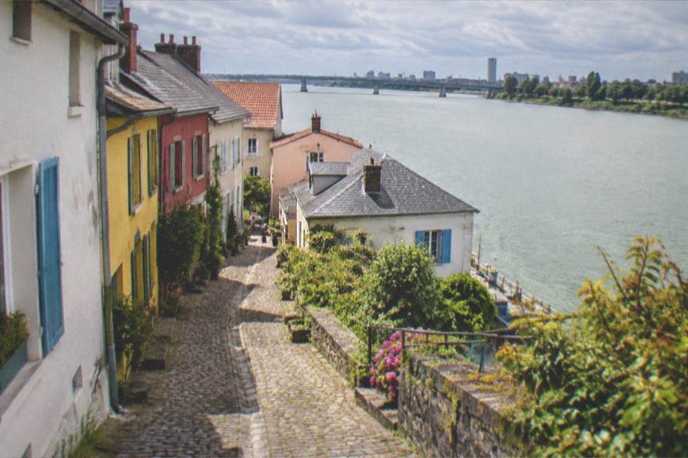Colourful riverside houses along the water at Trentemoult near Nantes