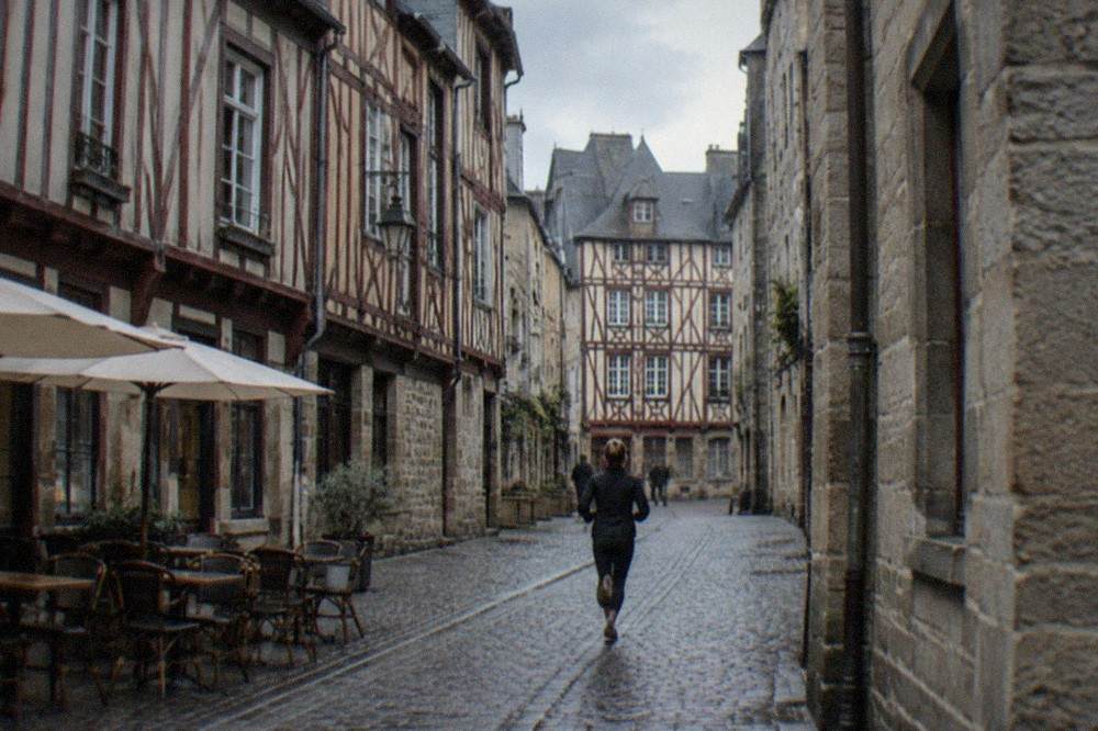 Narrow medieval street with half-timbered buildings in the Bouffay quarter of Nantes