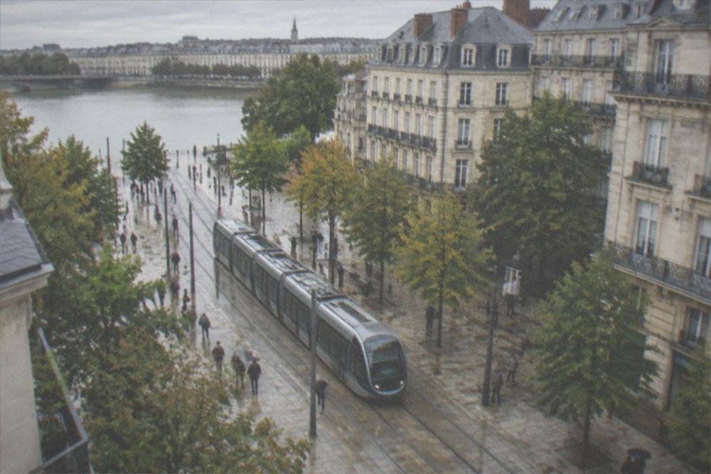 Modern Nantes tram passing through a pedestrianised street in the city centre