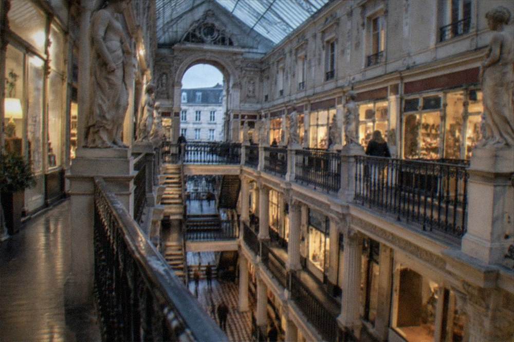 Lit shopfronts inside the 1843 Passage Pommeraye shopping arcade in Nantes