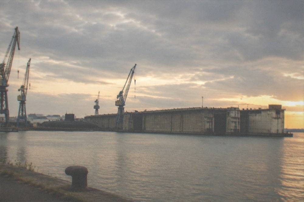 The vast hull and dockyard cranes of Saint-Nazaire on the Loire estuary