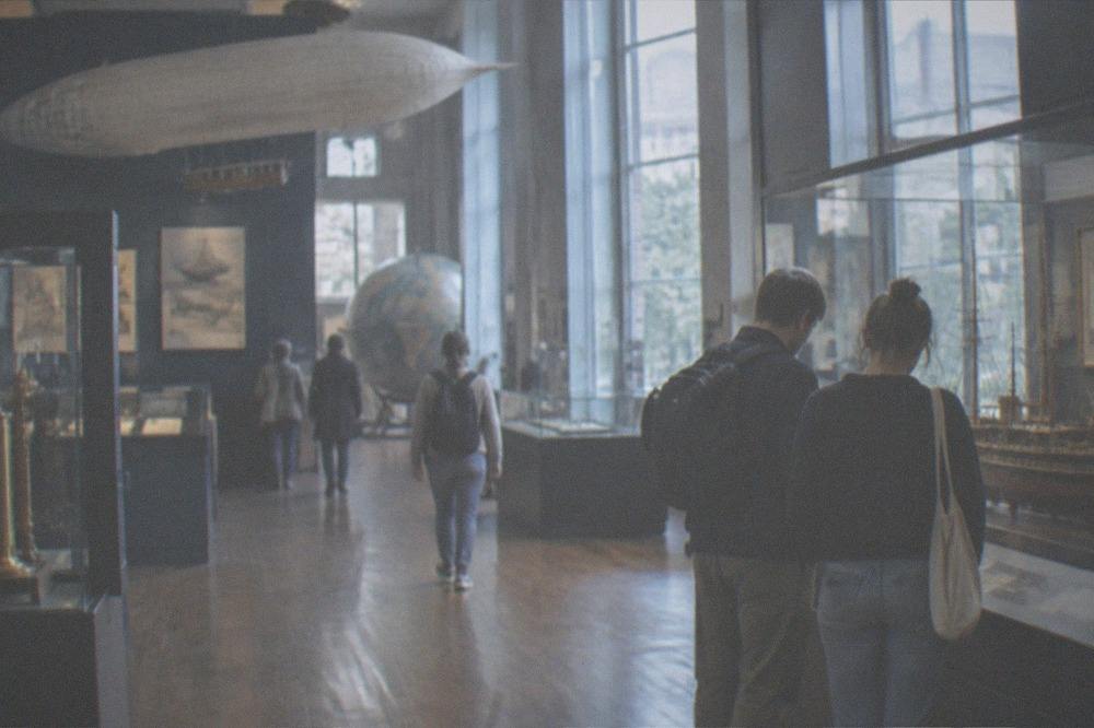 Visitors looking at display cases in the Musée Jules Verne in Nantes