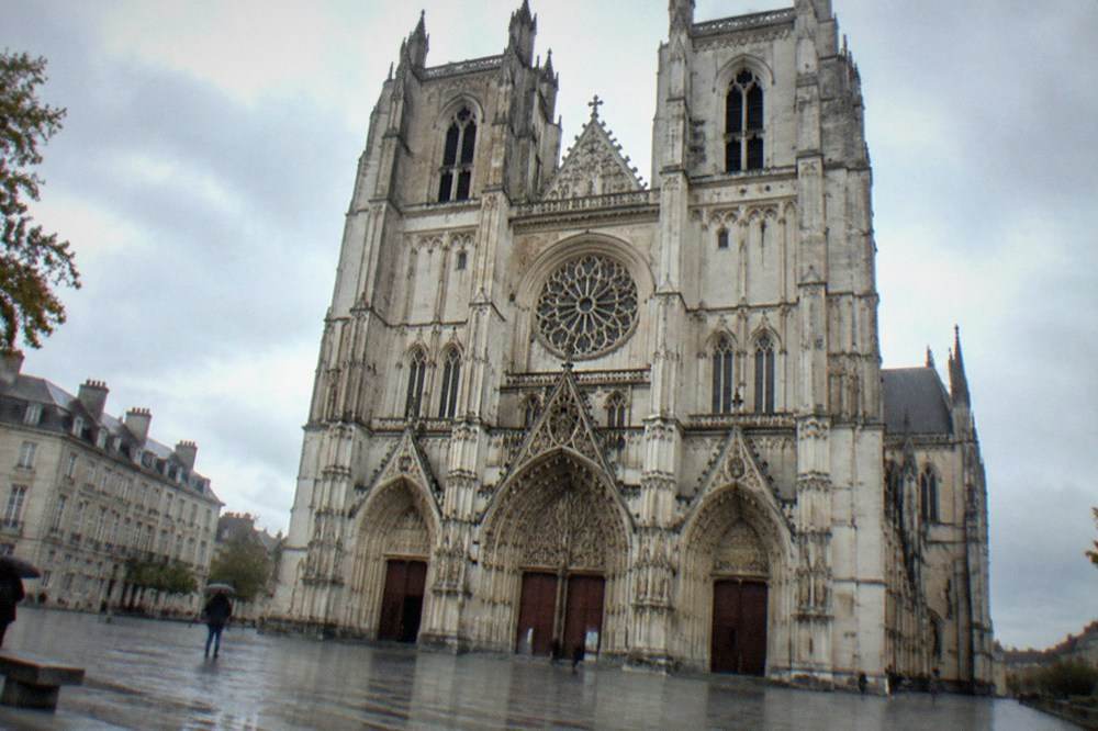 The tall gothic nave interior of Nantes cathedral with stone vaulting above