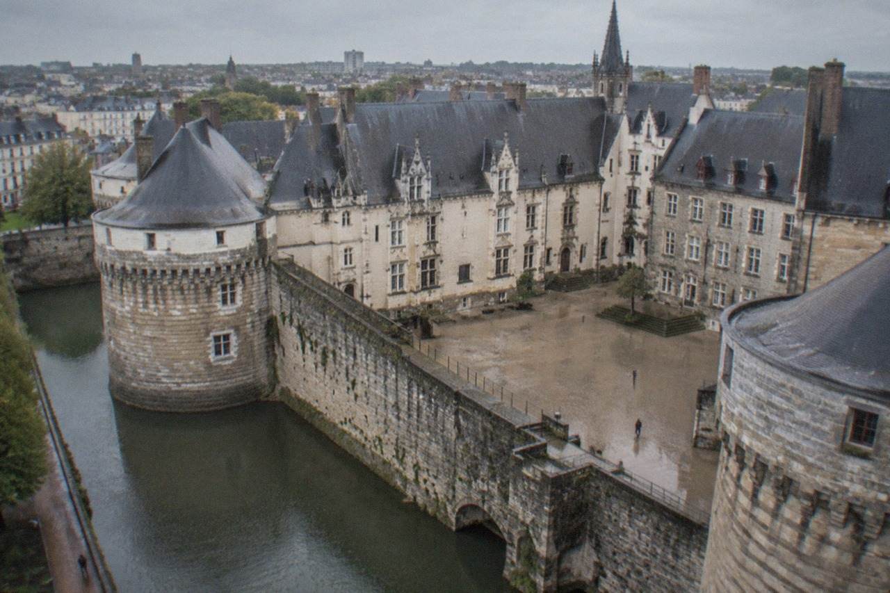 The ramparts and slate roofs of the Château des ducs de Bretagne in Nantes on a bright morning